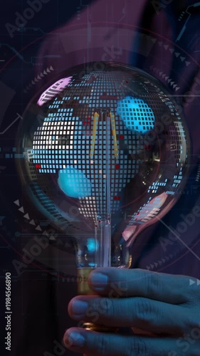 Businessman hand shows rotating planet earth inside light bulb with innovation technology background. Concept of big data analytics, business intelligence, global business and digital link technology.