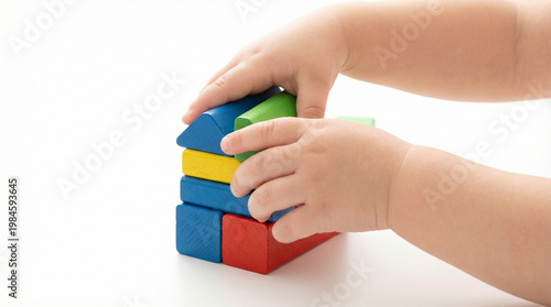 Building Blocks of Wonder: A child's tiny hands meticulously arrange colorful building blocks, symbolizing the boundless imagination and formative learning experiences of early childhood.