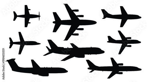 A collection of black silhouettes of various airplanes in flight against a white background