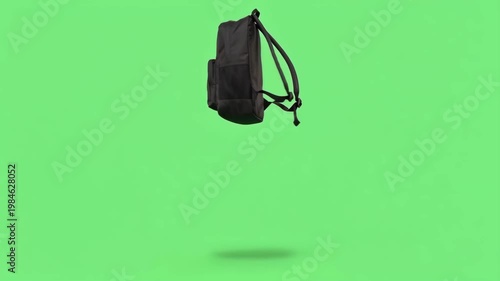 backpack jumps with joy on a green screen before heading to school or class