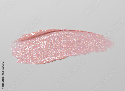 Smudged pink lipstick on a white background close-up.