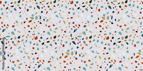 Abstract pattern of colorful terrazzo style chips on a light background
