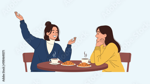 Two young women sitting at a table with coffee and croissants engaged in an animated and friendly conversation together.