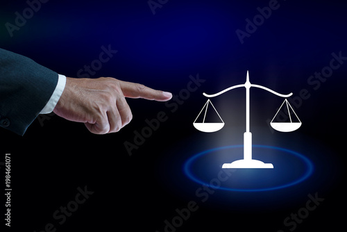 Businessman pointing law technology symbol on virtual screen. Law and justice concepts.