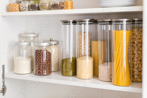 storing bulk dry foods in glass jars in a cupboard, kitchen pantry, plastic-free