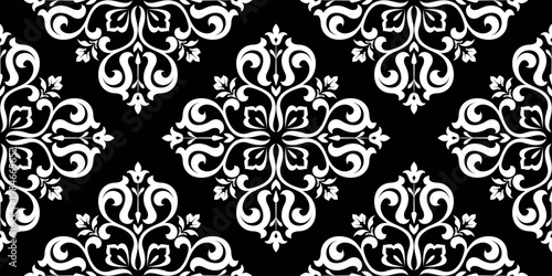 Wallpaper in the style of Baroque. White and black floral ornament. Seamless vector background. Graphic pattern for fabric, wallpaper, packaging. Ornate Damask flower illustration.