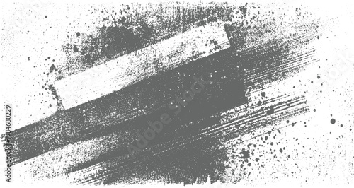 Textured grey paint brush strokes and splatters on white background