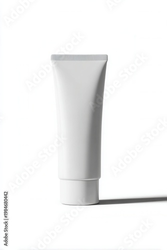 Minimalist white tube stands against pure white background