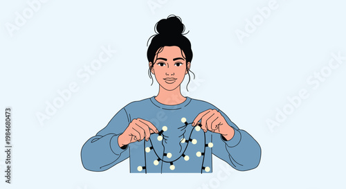 Young woman with her hair in a bun holds a string of glowing warm white lights while looking forward with a calm smile.