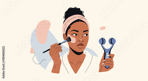 Beautiful woman applying foundation with a makeup brush and holding a facial massage roller for her daily beauty routine.