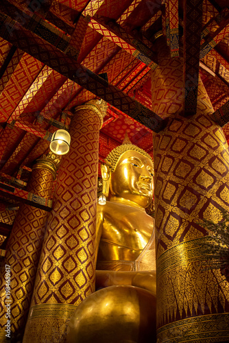 Golden the huge Buddha statue enshrined in Wat Phanan Choeng, called Wat Luang Pho Tho in Ayutthaya, Thailand.