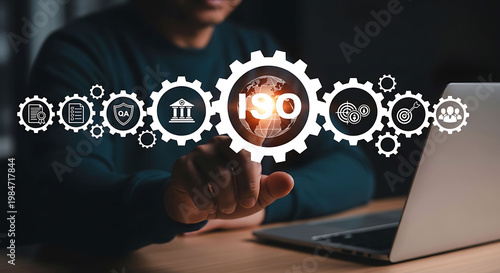 Businessman touching ISO certification icon representing quality management and global standards