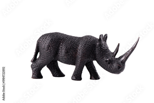 Handmade Wooden Rhinoceros Sculpture with detailed carved texture, isolated on white background. African safari theme, and artisanal craftsmanship