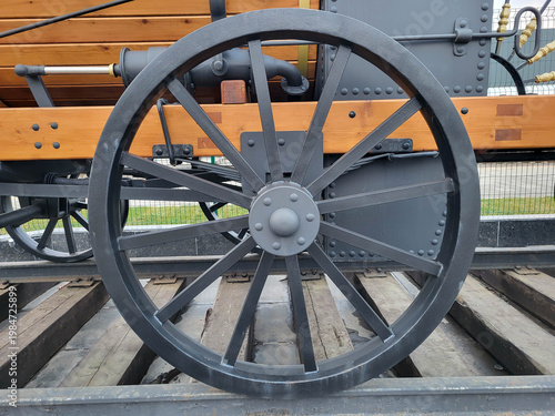 Detail of a black wheel from an old steam locomotive