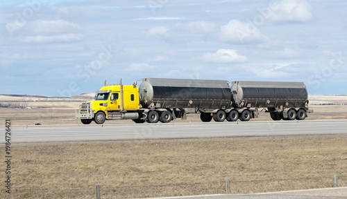Heavy Cargo on the Road. A truck transporting cargo along a highway. Taken in Alberta, Canada