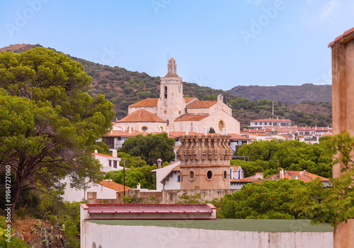 Village church and hillside houses in Cadaques, Catalonia, Spain