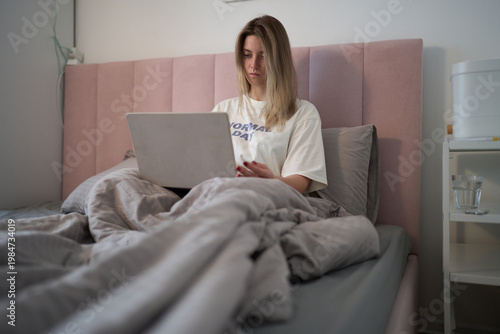 Early Day Laptop Session in a Cozy Bedroom