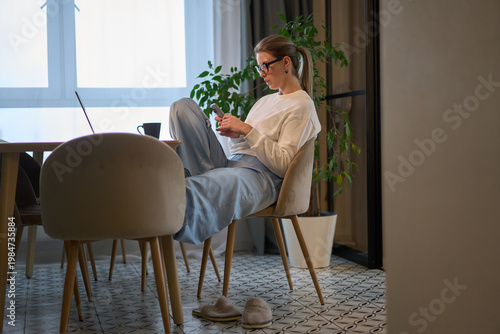 Unhurried Moment on Her Phone in a Bright Quiet Room