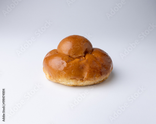 Traditional Sicilian brioche “brioscia col tuppo,” soft sweet bun served with gelato or granita, highlighting authentic Italian pastry and summer dessert culture.