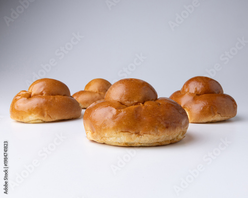 Traditional Sicilian brioche “brioscia col tuppo,” soft sweet bun served with gelato or granita, highlighting authentic Italian pastry and summer dessert culture.