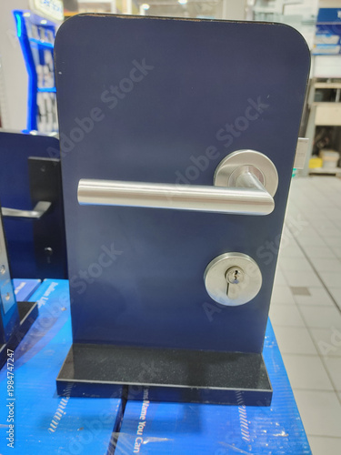 modern satin stainless steel door lever handle set on the displayed for sale at hardware store