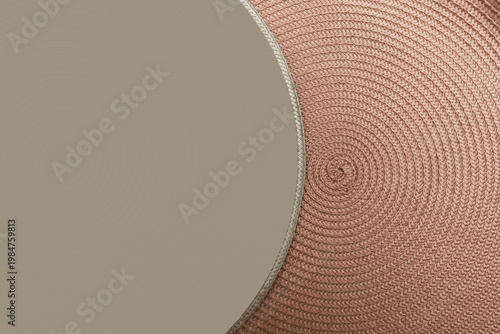 Neutral woven circular textile placemat texture background in beige and brown tones