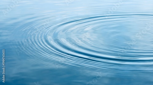 Calm blue water with concentric ripples.