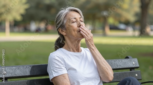 Relaxed Senior Woman Enjoying Peaceful Moment in Park