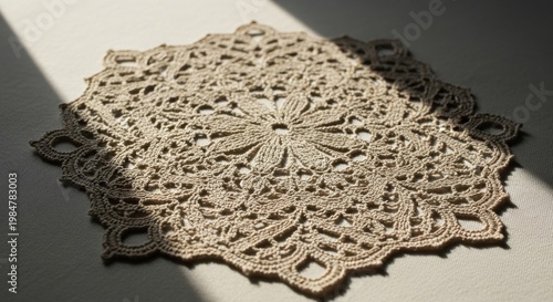 Intricate beige floral lace doily with delicate handcrafted patterns, showcasing vintage artistry and traditional textile design.