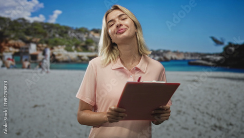 Woman holding pink clipboard, smiling with slight head tilt and closed eyes, hands gripping clipboard visibly in a studio set with beach backdrop; serene focus.