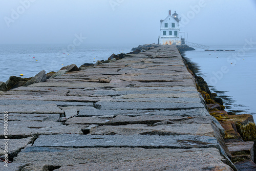 lighthouse on stone breakwater
