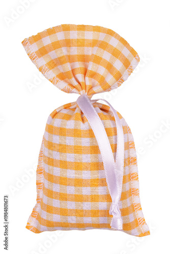 Yellow gingham or vichy check fabric sachet filled with lavender herbs as moth repellent or anti stress remedy