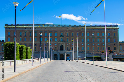 Canvas Print Kungliga Slottet Royal Palace in Stockholm with Swedish flags and symmetrical pe