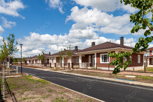 Modern suburban houses on new residential street, real estate development