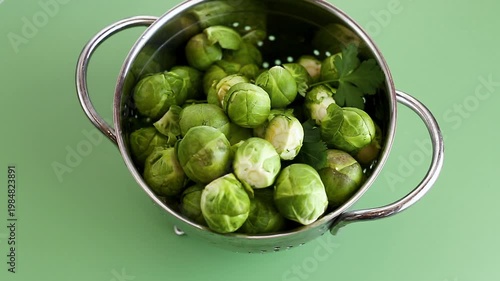 green Brussels sprouts in a colander