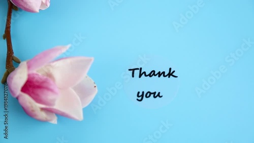 elegant floral composition with pink magnolia and thank you text