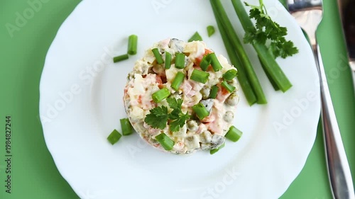 delicious creamy potato salad with peas carrots and green onion