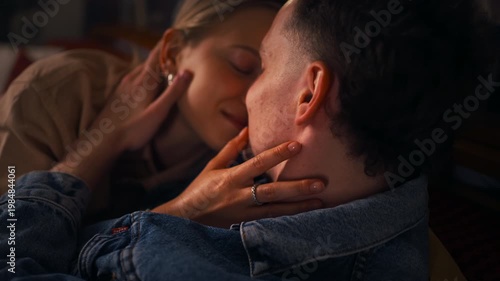Intimate Moment On Cozy Sofa. Soft Lighting Highlights Tender Affectionate Bonding