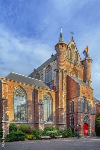 Facade of Pieterskerk church in Leiden, Netherlands. Gothic architecture of the historical monument under cloudy sky