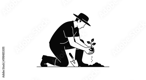 A gardener kneels to plant a small seedling carefully nurturing new life in the soil a striking silhouette high quality professional