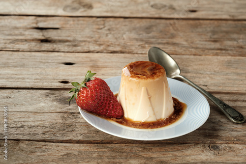 Enjoy Panna Cotta Dessert With Fresh Strawberry on Wooden Table