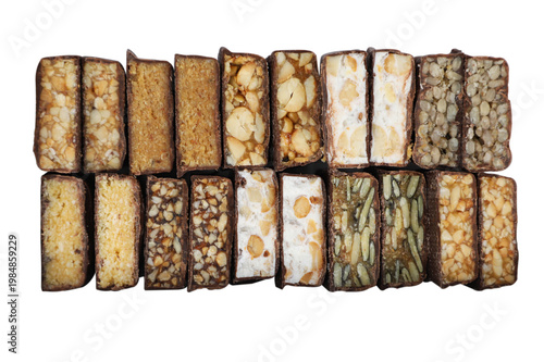 Top view of a group of various cereal bars on a white background.