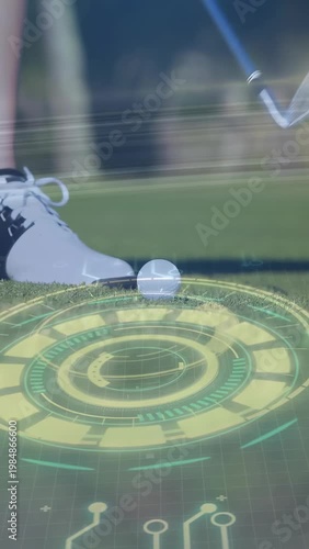 Vertical video: Golfer placing foot and starting swing blue club hitting ball as golf HUD guiding