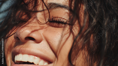 Radiant Moment: A close-up shot of a person radiates pure happiness and contentment, showcasing their beautiful smile and the gentle interplay of sunlight on their hair.