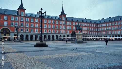 A rainy day in the Plaza de Madrid, Spain, amidst tourism and history