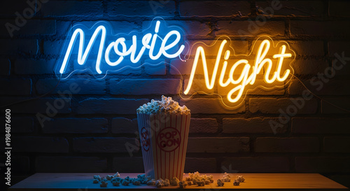 A neon sign that says movie night next to a popcorn bucket 