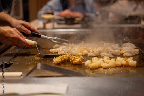 Hibachi chef cooking seafood
