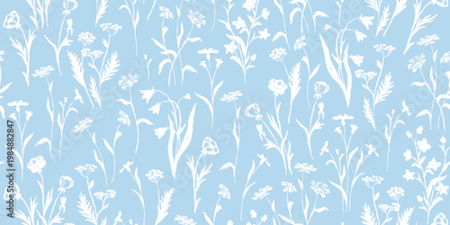 Seamless pattern with hand drawn white wildflower silhouettes on blue background