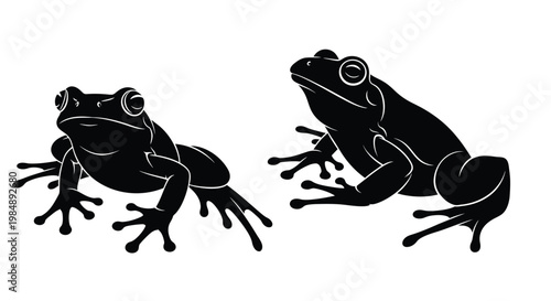 Two black frogs in different poses on transparent background silhouette