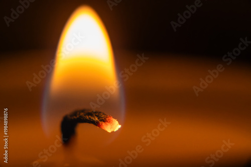 burning match on a dark background